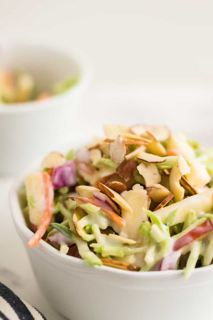 closeup of  broccoli slaw in a white bowl